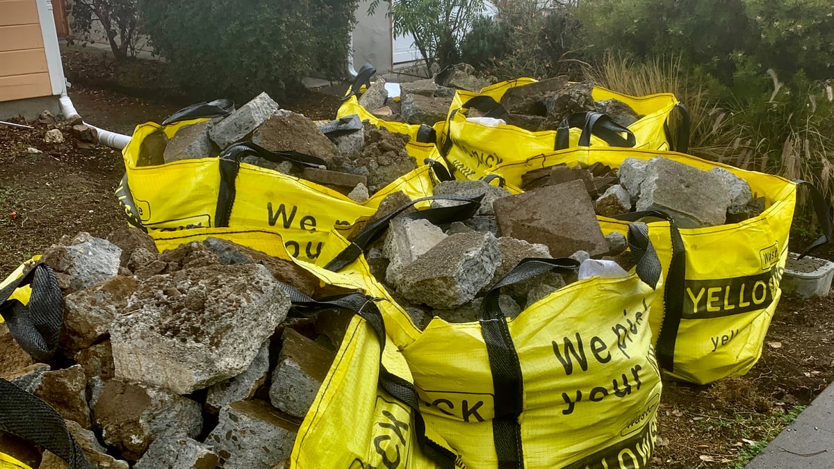 A Medium Yellowsack filled with broken concrete